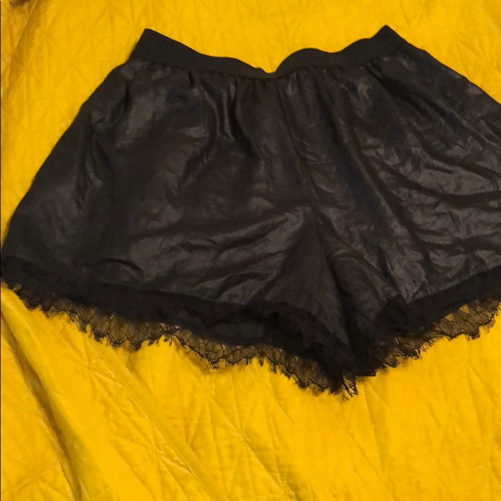 BCBG black shorts with lace on the hem